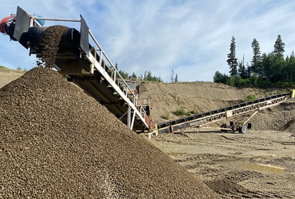 Drain rock being processed at Patterson Gravel Pit — conveyor and stockpile