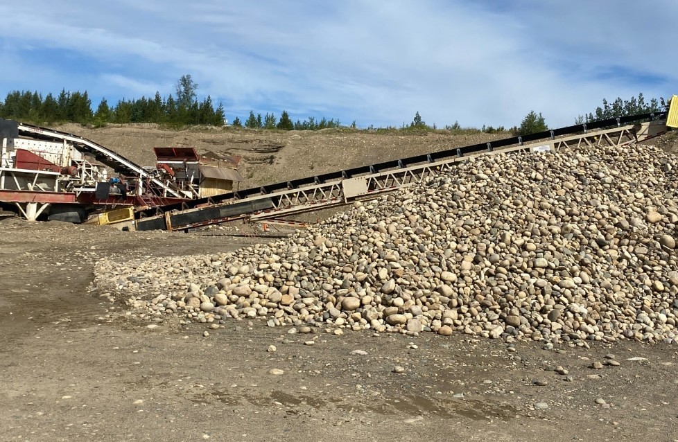 Round rock boulder pile Patterson Gravel Pit Prince George BC — screening operation
